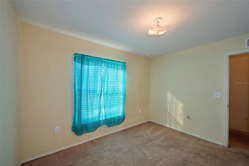 Front guest bedroom offers carpeting