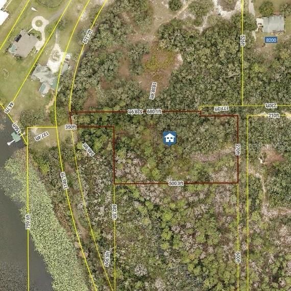 Satellite view of property and proximity to lake with measurements of lot