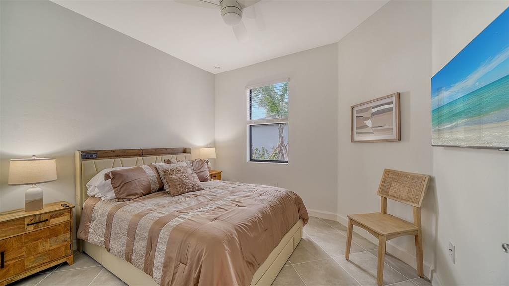 Guest Bedroom with Queen size bed and TV