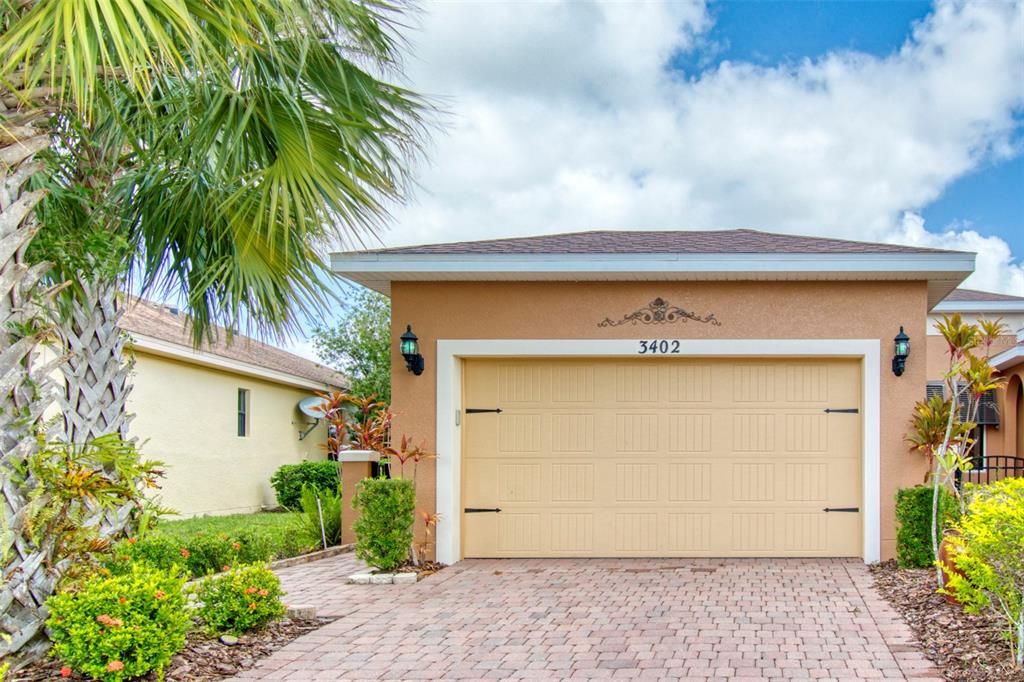 Wide drive leads guests to a private courtyard