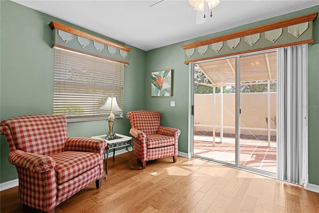 Sliding glass doors lead to the birdcage area.