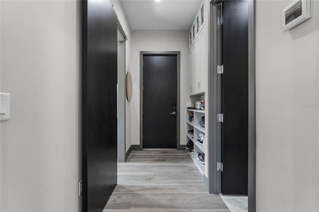 Mudroom: Convenient and chic! This custom-built mudroom with built-in storage is the perfect catch-all space as you come in from the garage.