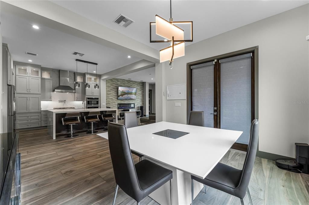 Dining Area: Dine in style! With sleek modern lighting and views of the outdoor lanai, this open-concept dining area is perfect for hosting friends and family.