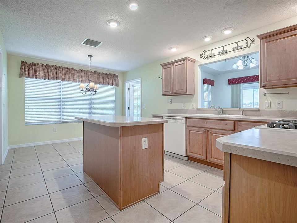 THE KITCHEN ISLAND GIVES YOU EVEN MORE COUNTER SPACE