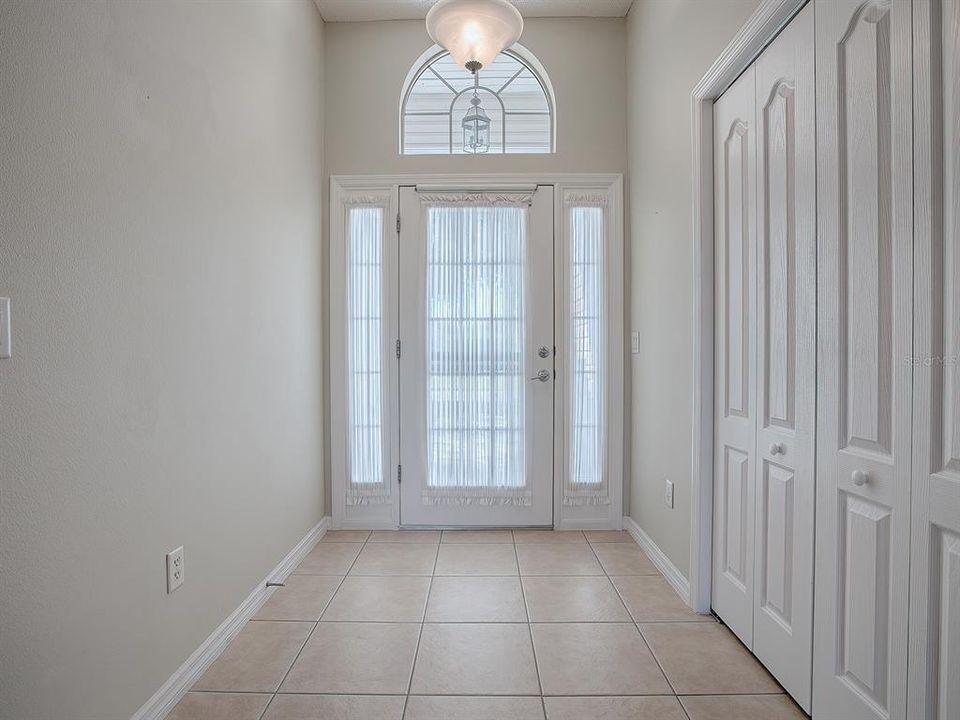 LIGHT AND BRIGHT FOYER WITH DOUBLE-DOOR CLOSET