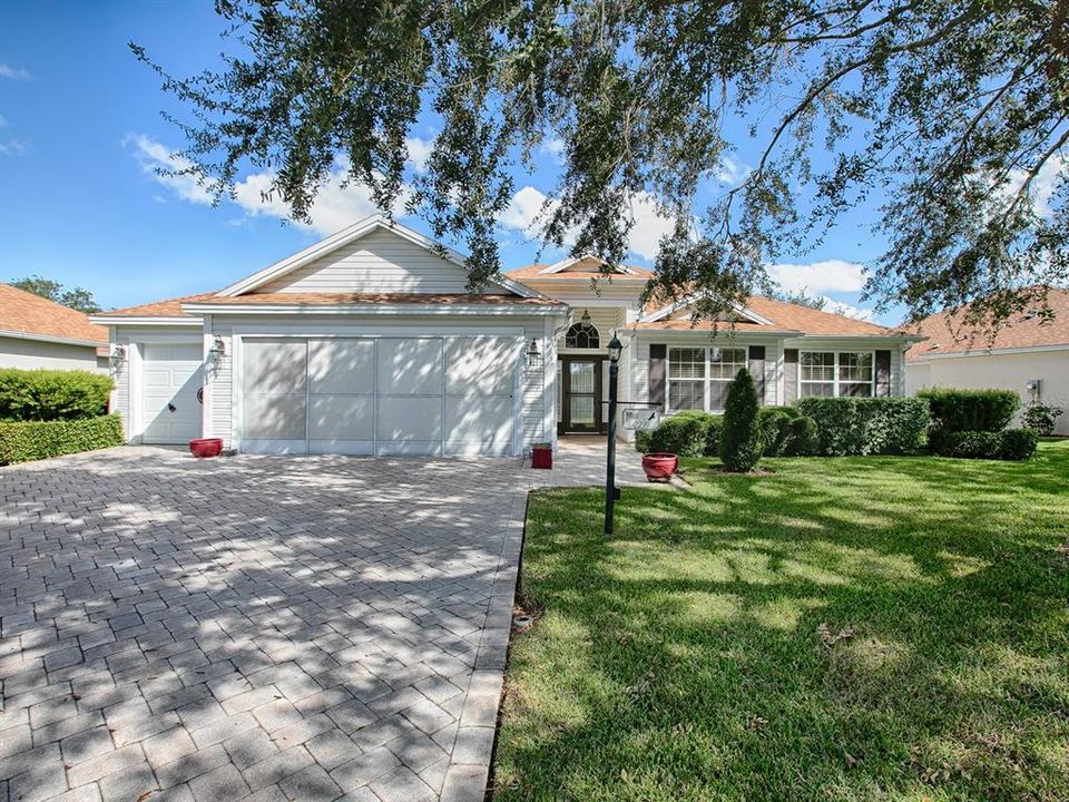 PAVERED DRIVEWAY, GARAGE SCREEN AND LOVELY CURB APPEAL