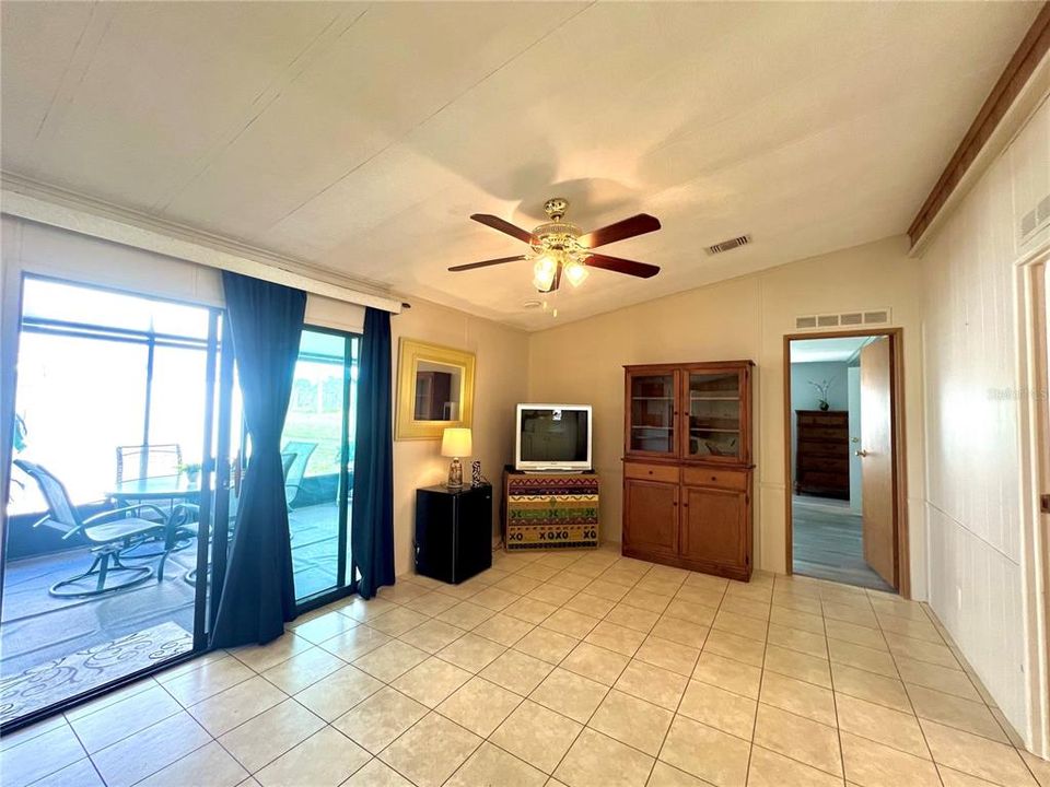 Living room with slider access to the side lanai