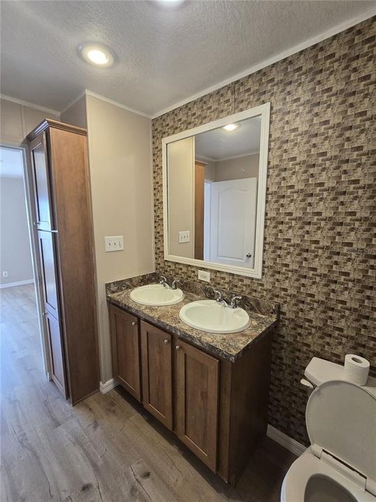 The en suite also offers a separate shower and soaking tub.