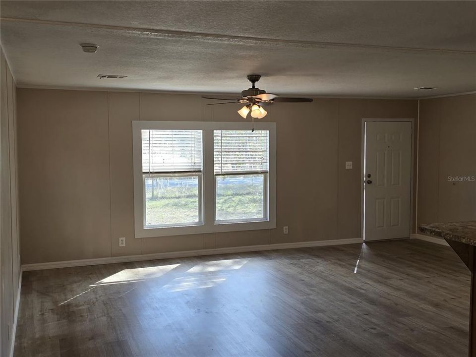 The kitchen opens up to the living room making it ideal for entertaining guests or watching family while cooking delicious meals!