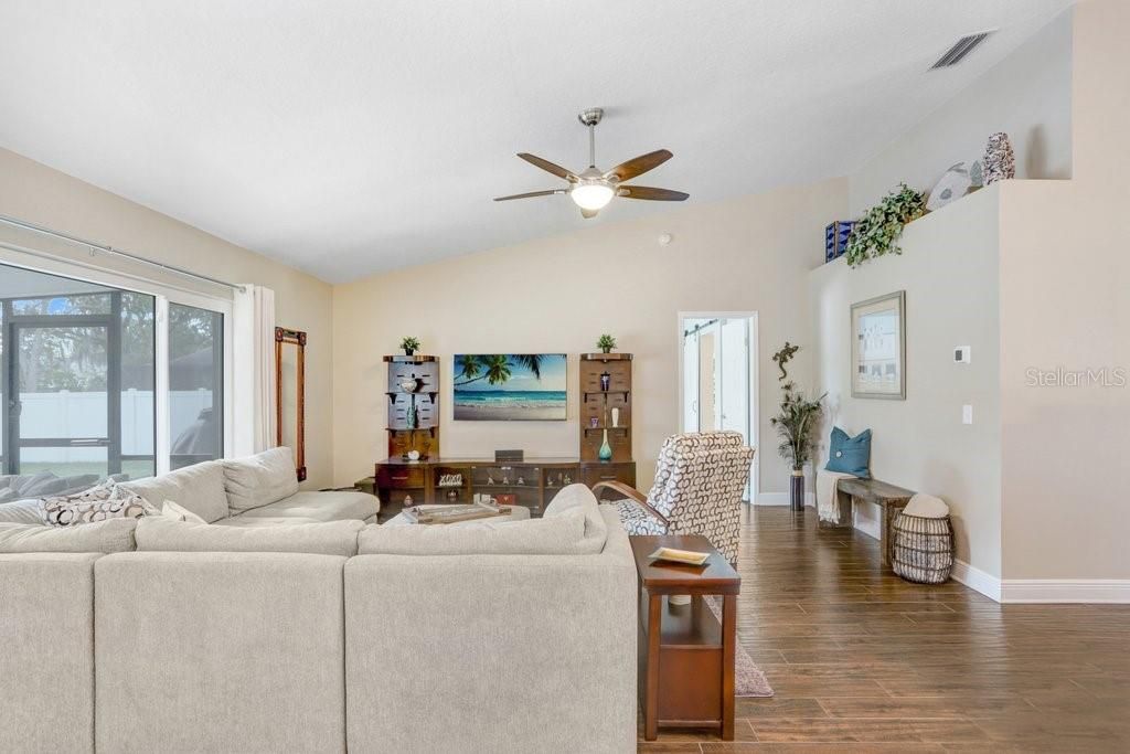 Main great room! There is ceramic plank tile flooring.....5-3/4 baseboards.....and high ceilings EVERYWHERE in the home!