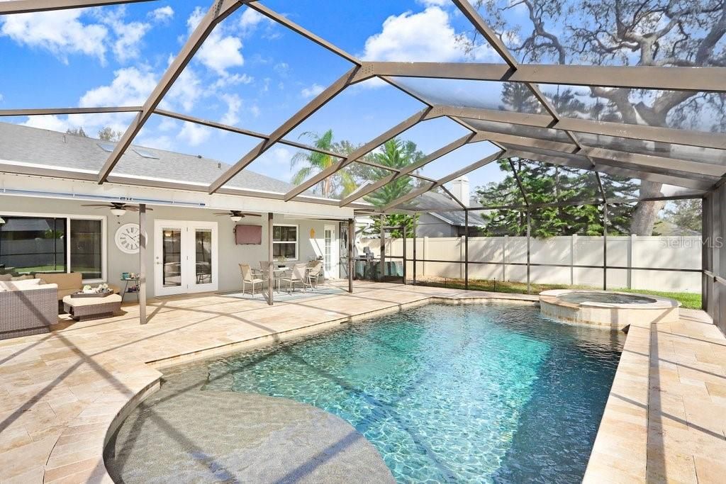 The pool and patio were redone in 2017. New pebble pool finish, new hot tub, new sunshelf, travertine tile, all new pool equipment, and added a pool heater too!