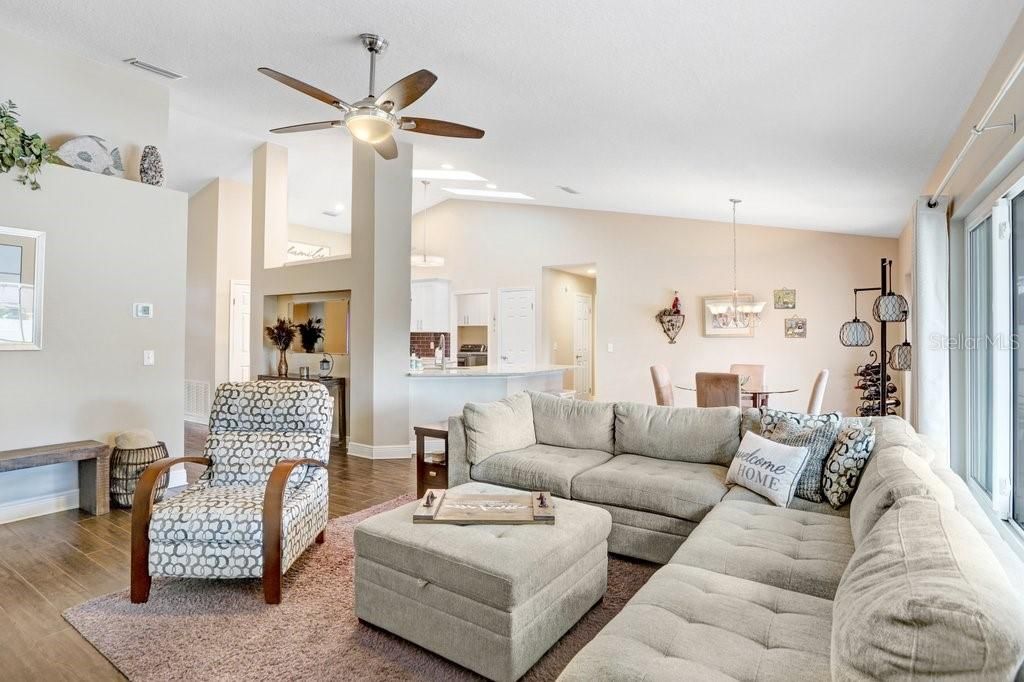 Main great room! There is ceramic plank tile flooring.....5-3/4 baseboards.....and high ceilings EVERYWHERE in the home!