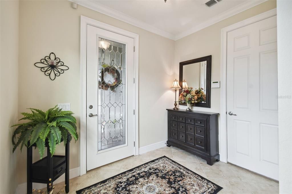 Leaded Glass Door lets natural light into the entry foyer