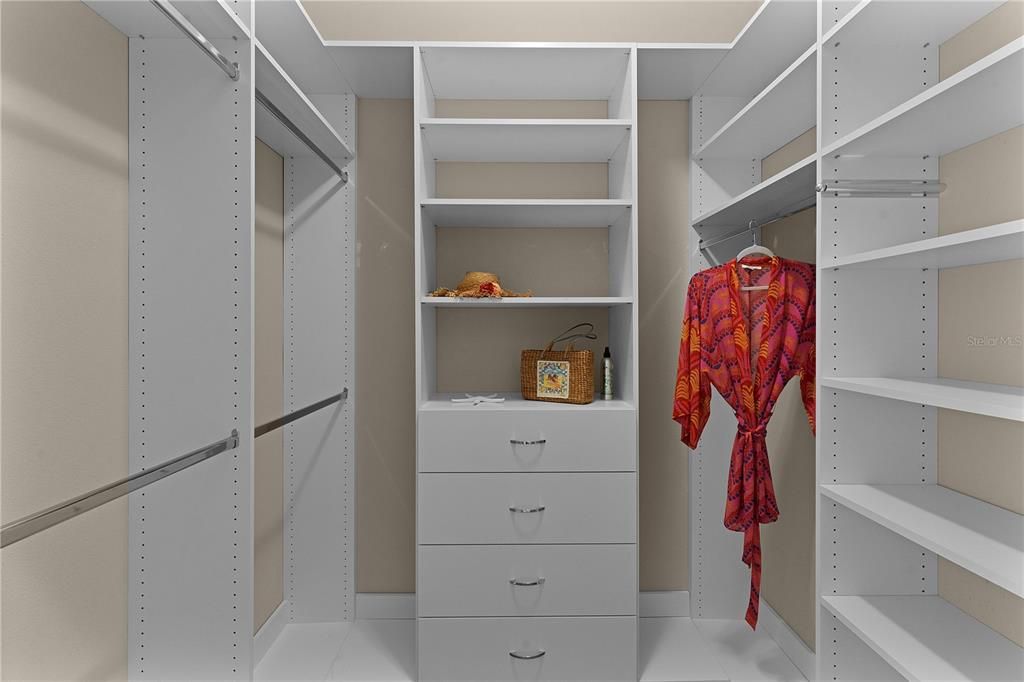 Two master walk-in closets with custom built-ins