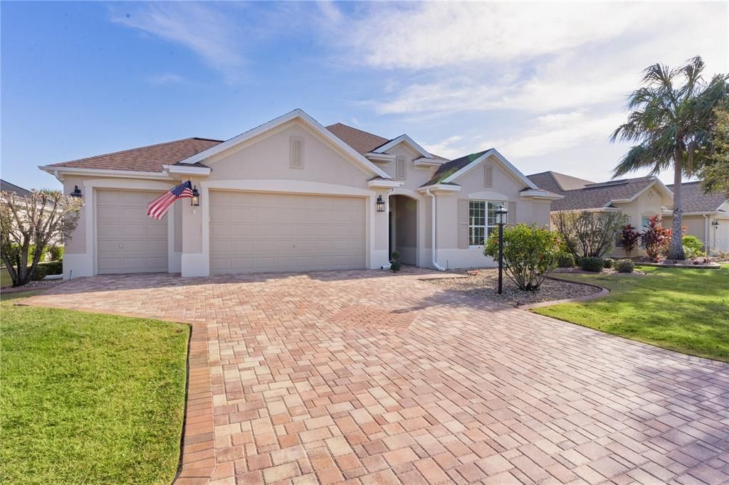 New exterior lighting & Paver driveway & walkway enhances curb appeal