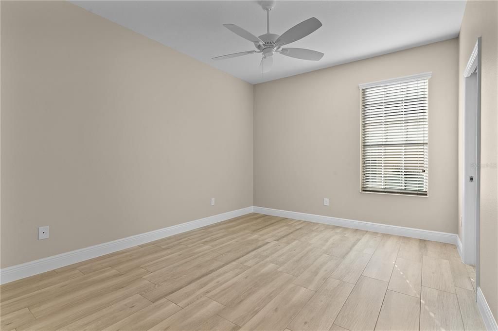 Wood plank tile floors in the guest bedrooms