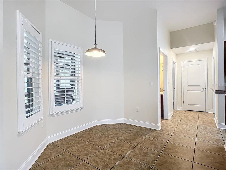 Breakfast nook overlooks lanai and kitchen bar area