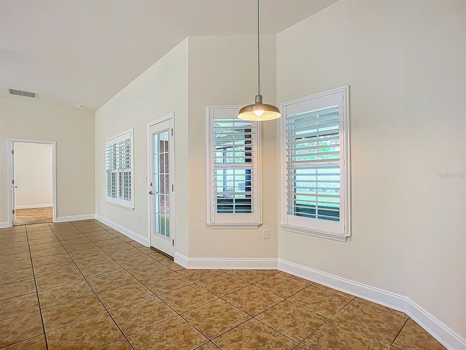 Breakfast Nook w/2 windows looking into lanai and door into the master bedroom