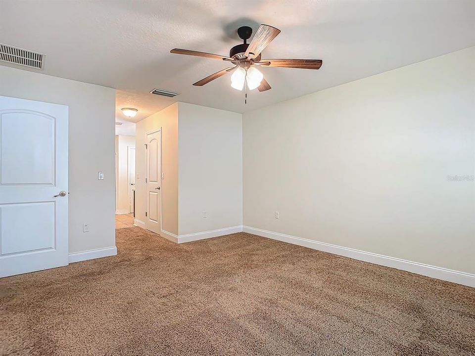 Master bedroom moving into master bath and past 2 walk in closets