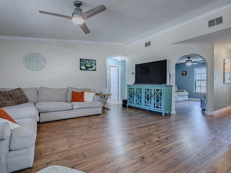 Family with viewings of Den & other bedroom wing of home