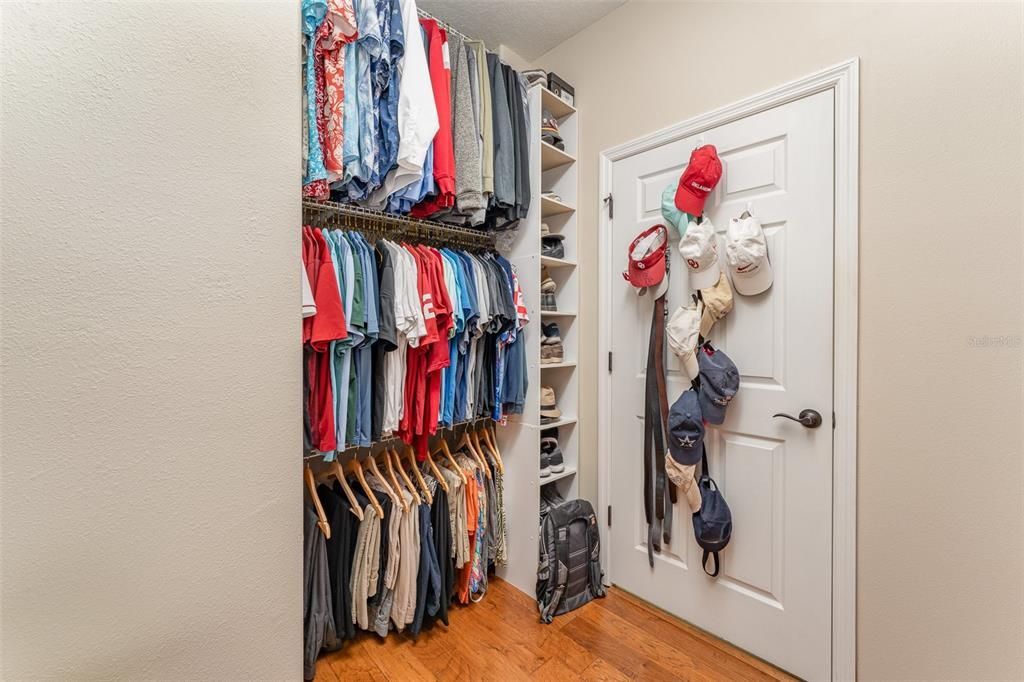 The other side of closet with 3 tier hanging