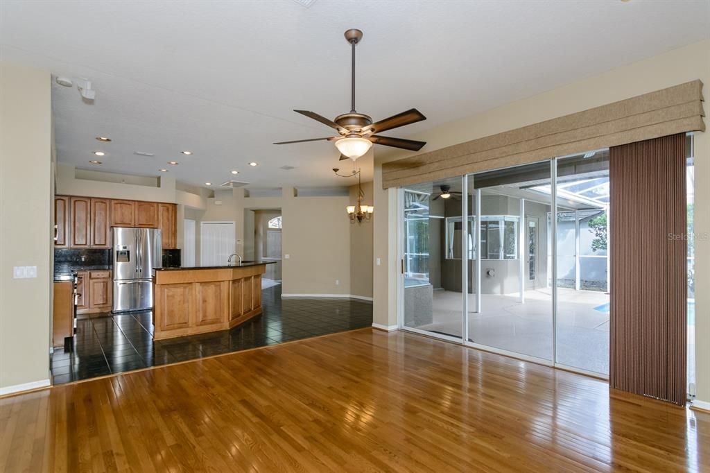 LIVING ROOM WITH SLIDERS TO POOL