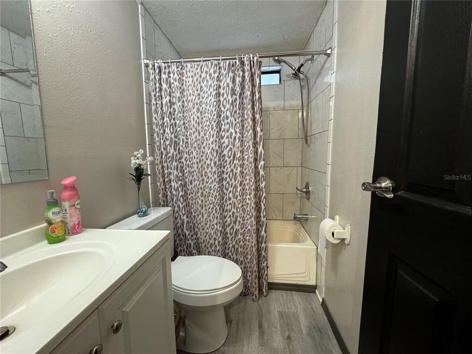 Bathroom Two / Refreshed with tile in the tub/shower combo