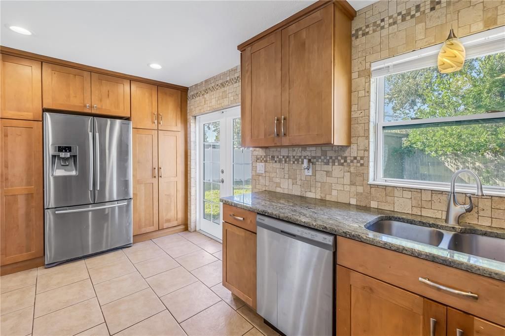 Kitchen boasts granite counter tops and stainless steel appliances.