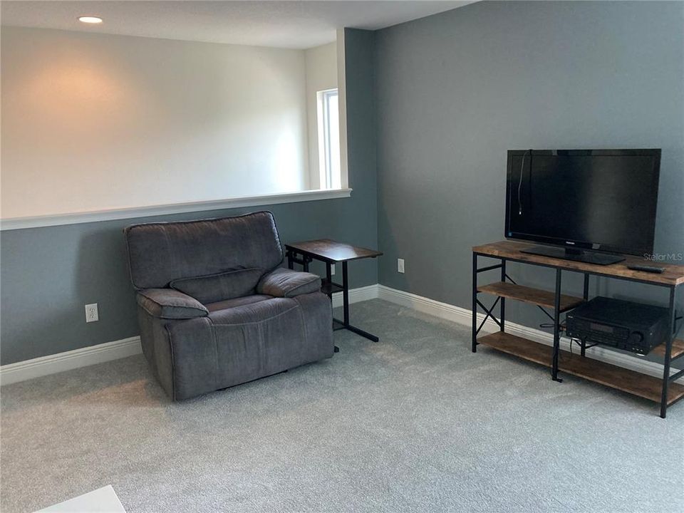 Second floor family room at top of the stairs