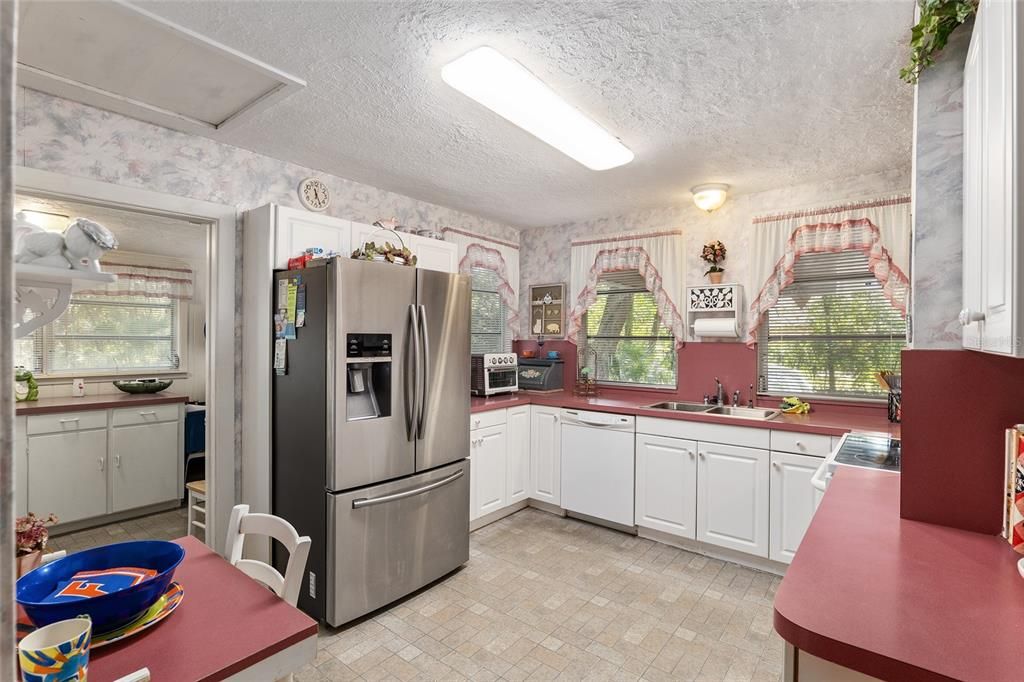 KITCHEN THAT OPENS TO INDOOR LAUNDRY ROOM