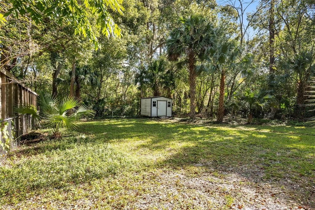 STORAGE SHED ALONG BACK OF PROPERTY LINE