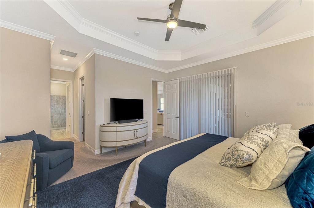 The master bedroom is large, with plenty of space for a full suite of furniture.