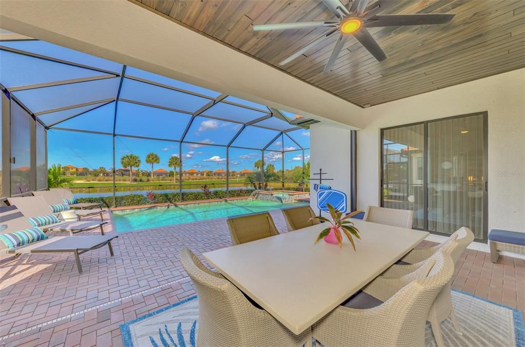 The lanai is stunning, outdoor kitchen, pool, spa, overlooking water and golf.