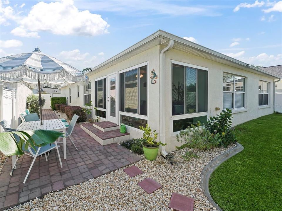 Side patio with pavers - grassy area in back