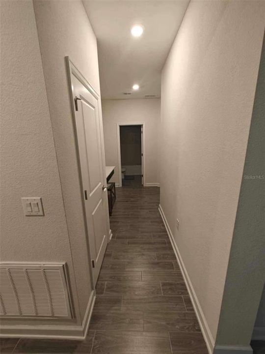 Hallway to second bathroom & bedroom