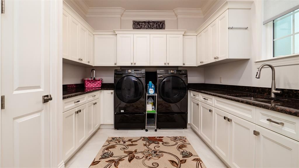 Laundry Room with tons of storage cabinets.