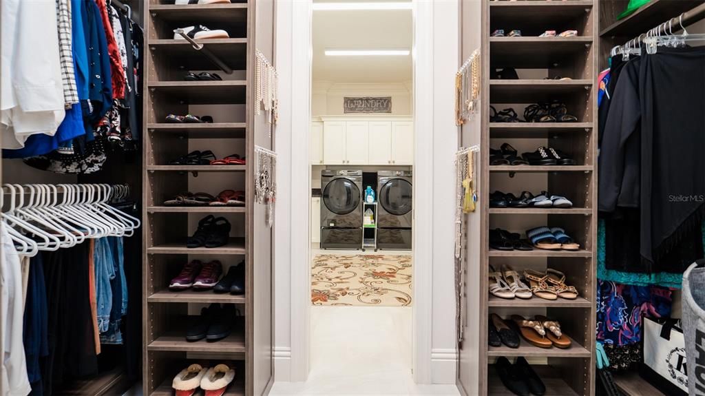 2nd custom closet with laundry room just beyond.