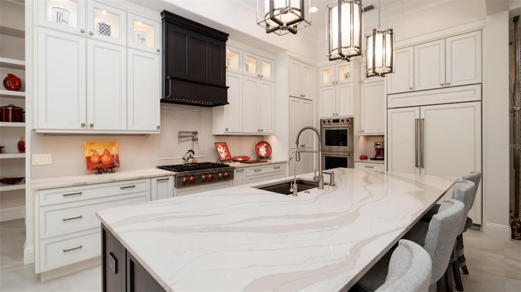 Gourmet kitchen with huge quartz island.