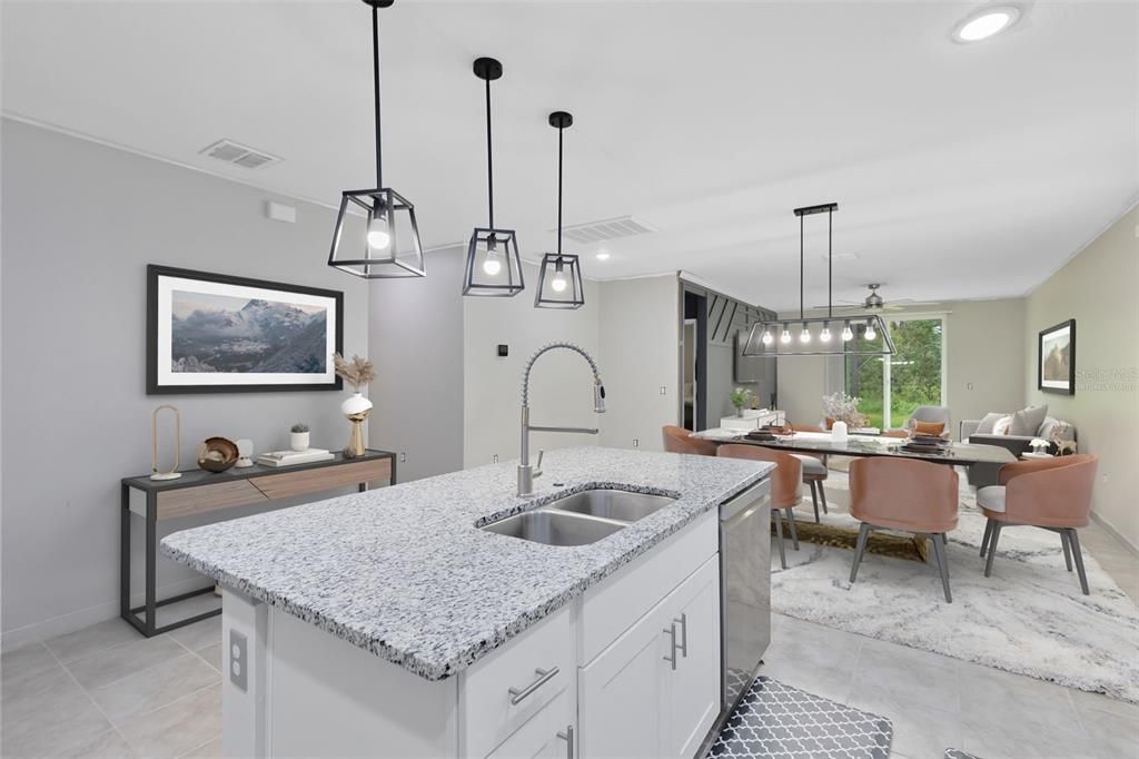 This photo has been virtually staged. View from the kitchen into the dining and living rooms.