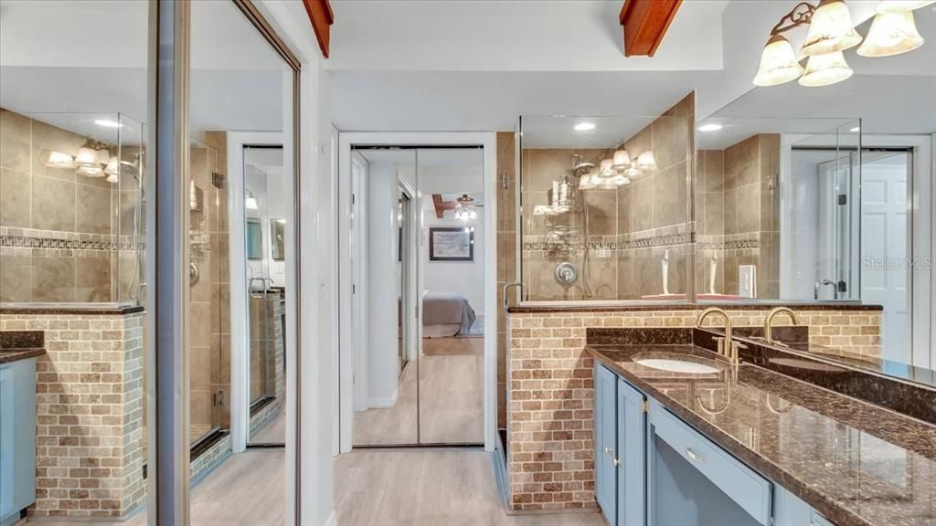 En-suite bathroom with double vanities, granite countertops, HUGE walk-in closet AND linen closet.