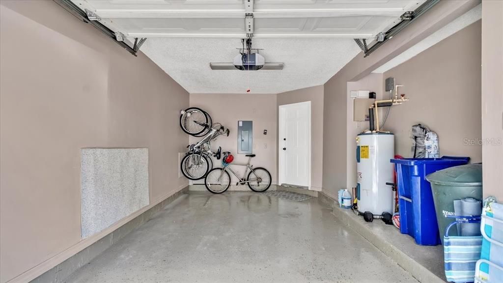 Nice clean epoxy flooring in garage with electronic door opener and pin access.