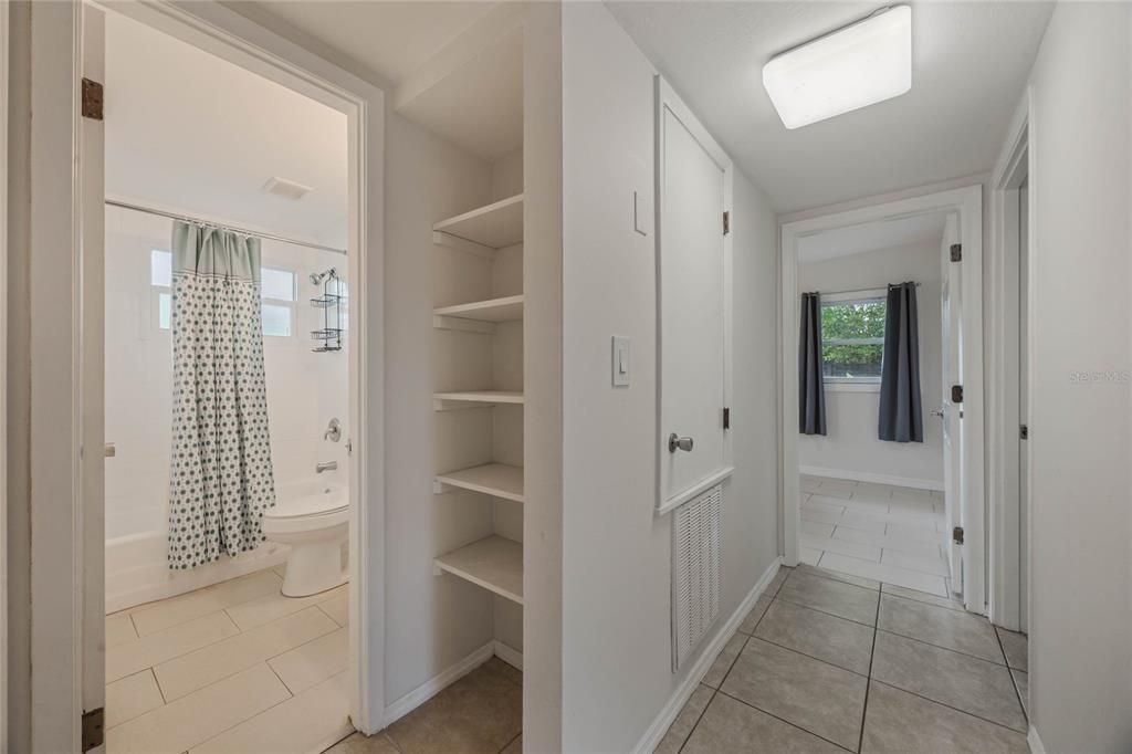 Hall bath, linen closet, hallway leading to the bedrooms