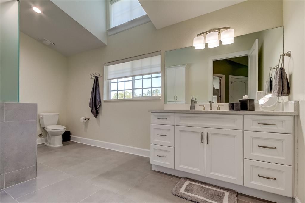 5th full bath, upstairs, tub with glass shower doors