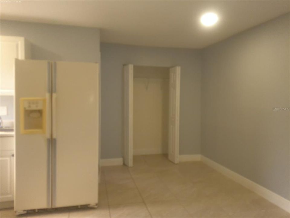 Interior with Image of Closet and Refrigerator