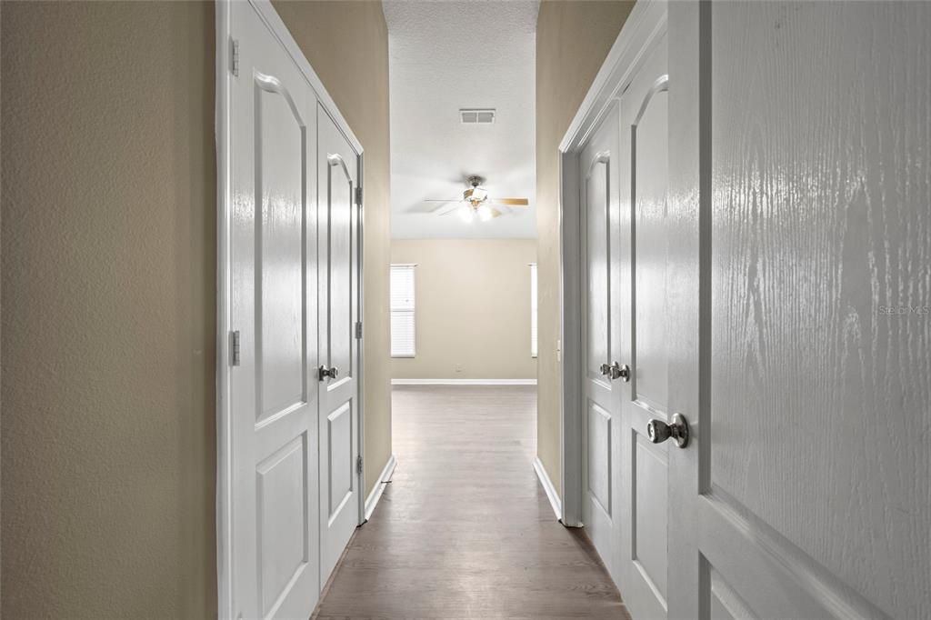 Master Bedroom Entrance with VAULTED CEILINGS. Master bath on the left & Master closet on the right.