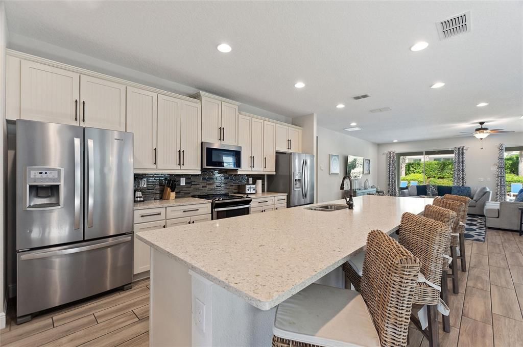 Plenty of eating space between using the island/breakfast bar, dining room, or at the large table on the lanai. (22' x 11')