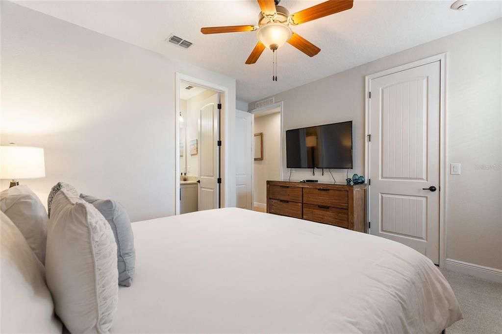 Another view of this guest bedroom looking toward the ensuite bathroom and walk-in closet.