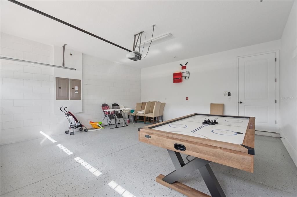 The garage has plenty of room for parking or convert it to another game room.