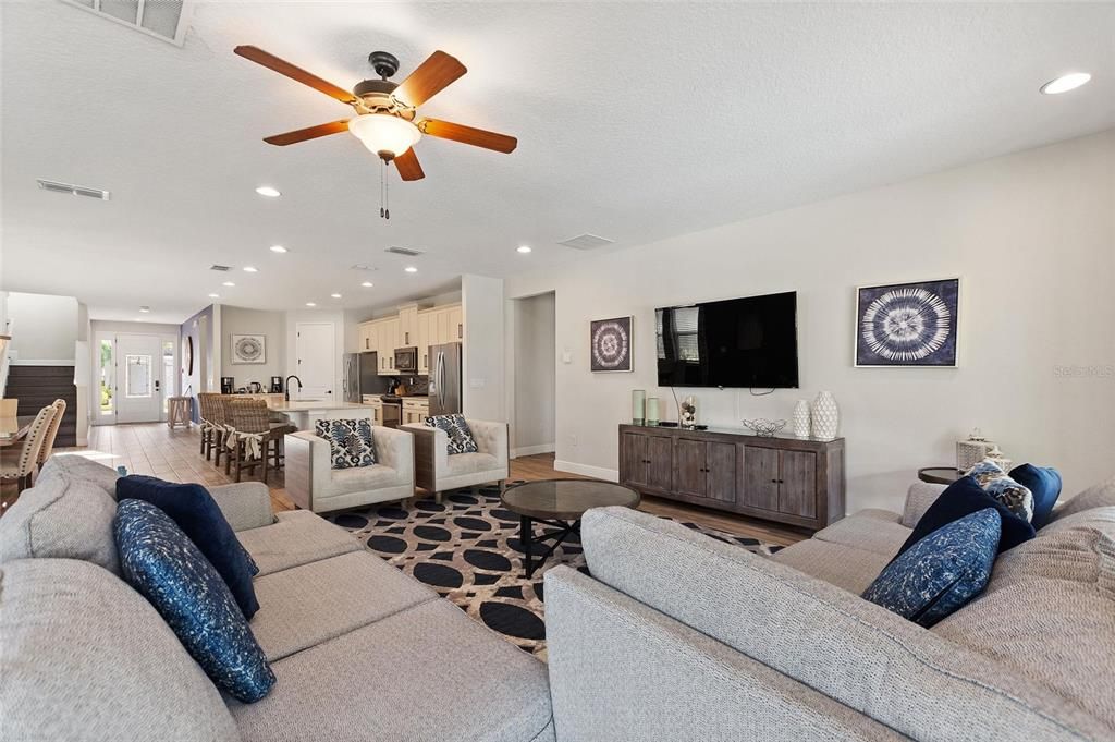 A view of the living room looking toward the entrance to one of the bedrooms.