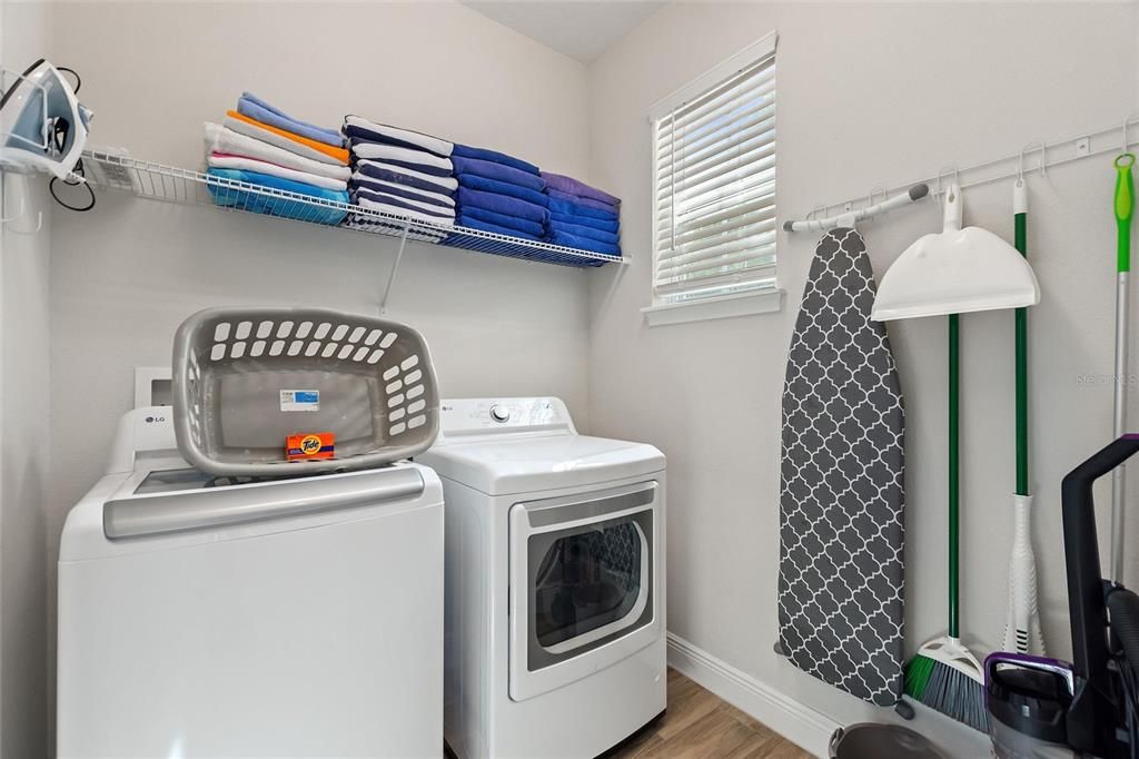 The laundry room is located downstairs.